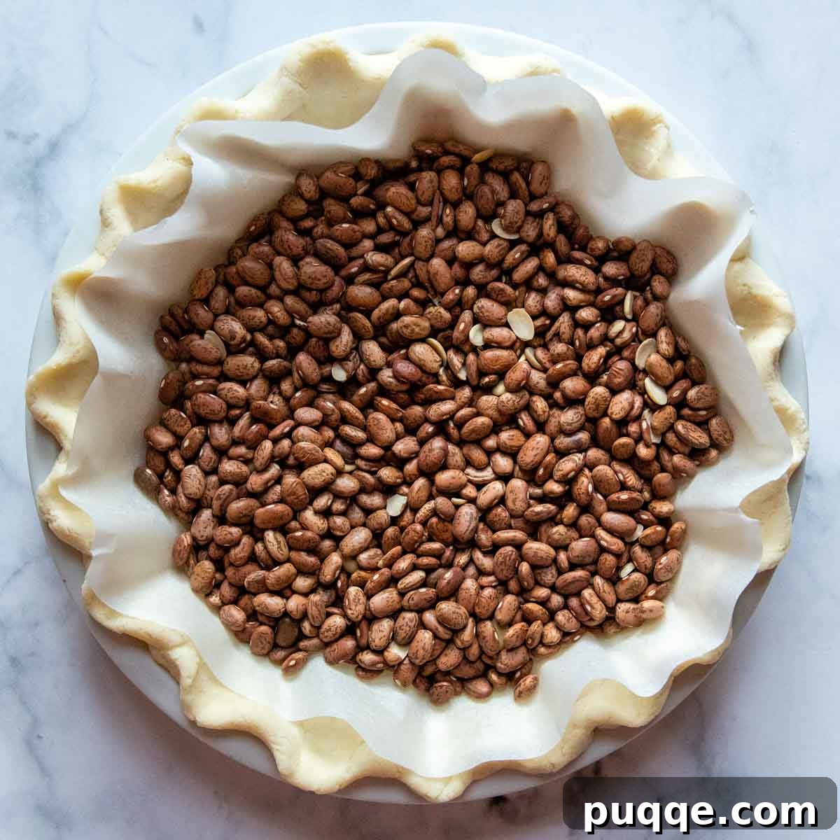 Southern Soul Gluten-Free Sweet Potato Pie with a Flaky Golden Crust 5 dried beans in an unbaked pie crust.