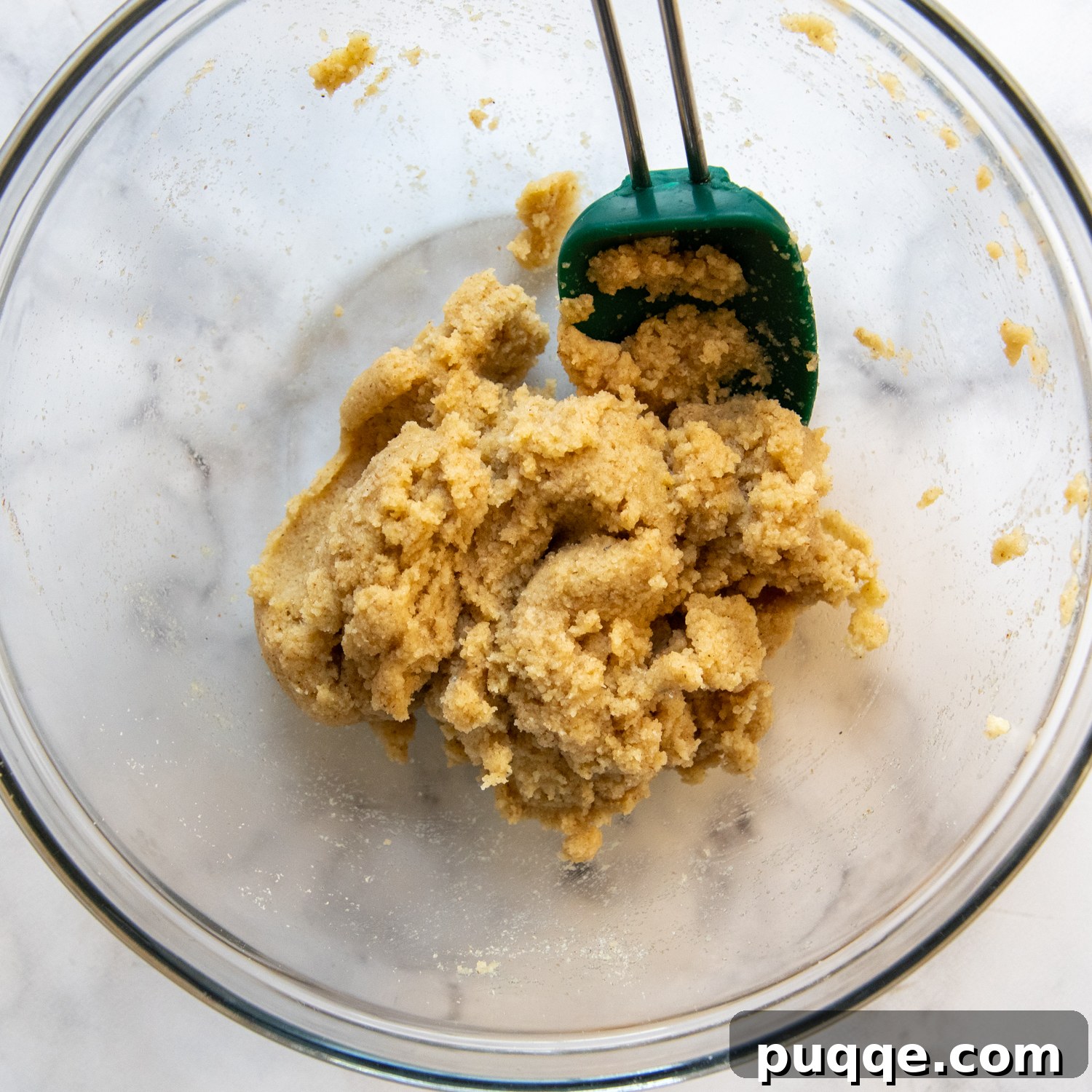 All the dry and wet dough ingredients artfully arranged in a mixing bowl before combining.
