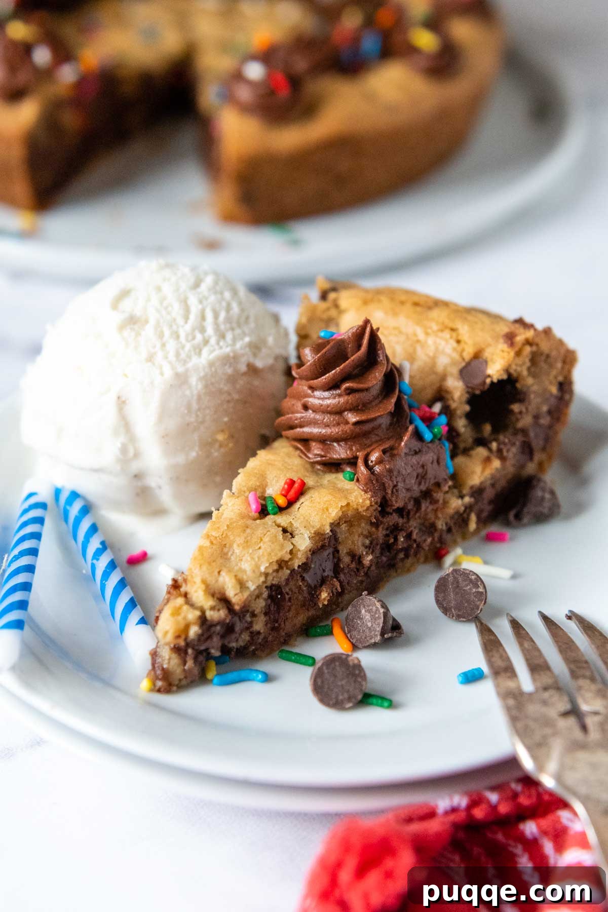 Irresistibly Soft Chewy and Moist Gluten Free Cookie Cake 5 a slice of cookie cake with a scoop of ice cream next to it.
