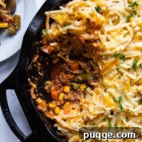 Easy Gluten Free Shepherd Pie 7 overhead shot of shepherds pie with a scoop taken out.