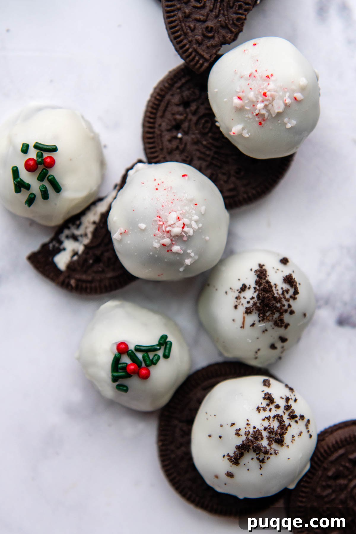 An array of beautifully decorated gluten-free Oreo balls featuring various sprinkles and chocolate coatings, showcasing diverse decorative possibilities.