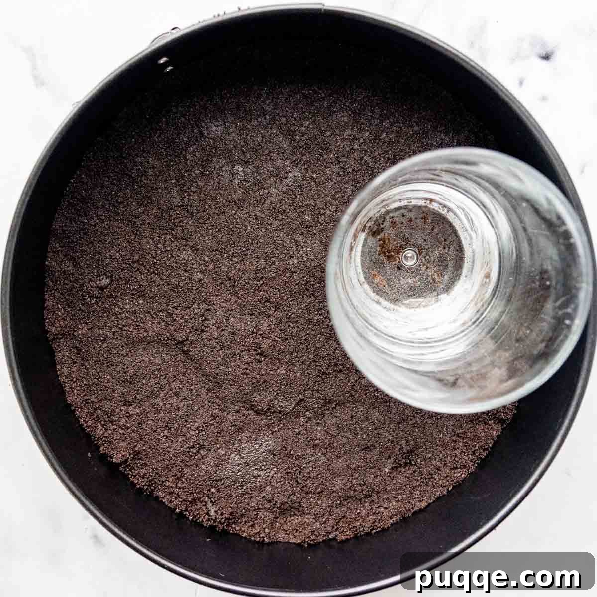 Velvet Smooth Gluten-Free Oreo Cheesecake Bliss 4 Gluten-free Oreo cookie crust firmly pressed into a springform pan.