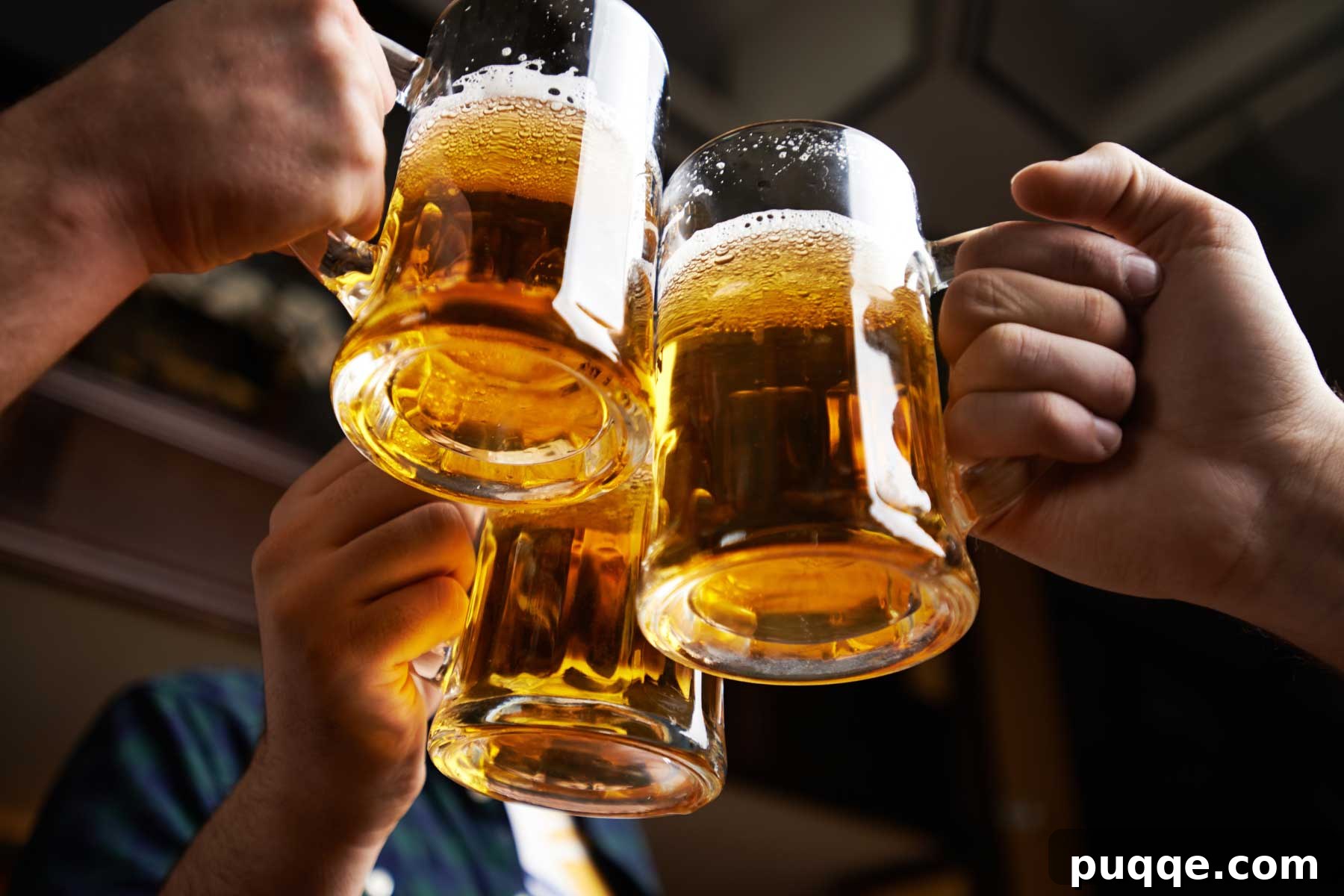 Three joyous beer mugs clinking together in celebration, symbolizing friendship and shared enjoyment of delicious brews.