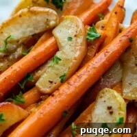 carrot apple side dish on a white plate.