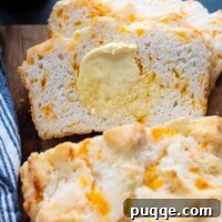 sliced gluten free beer bread with melting butter spread on.
