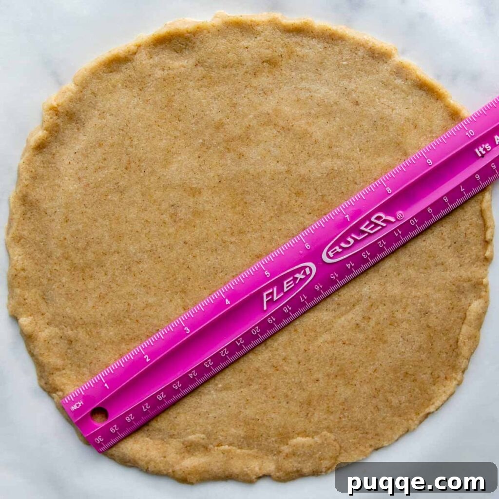 Ruler showing the 10-inch diameter of a rolled out pizza crust.