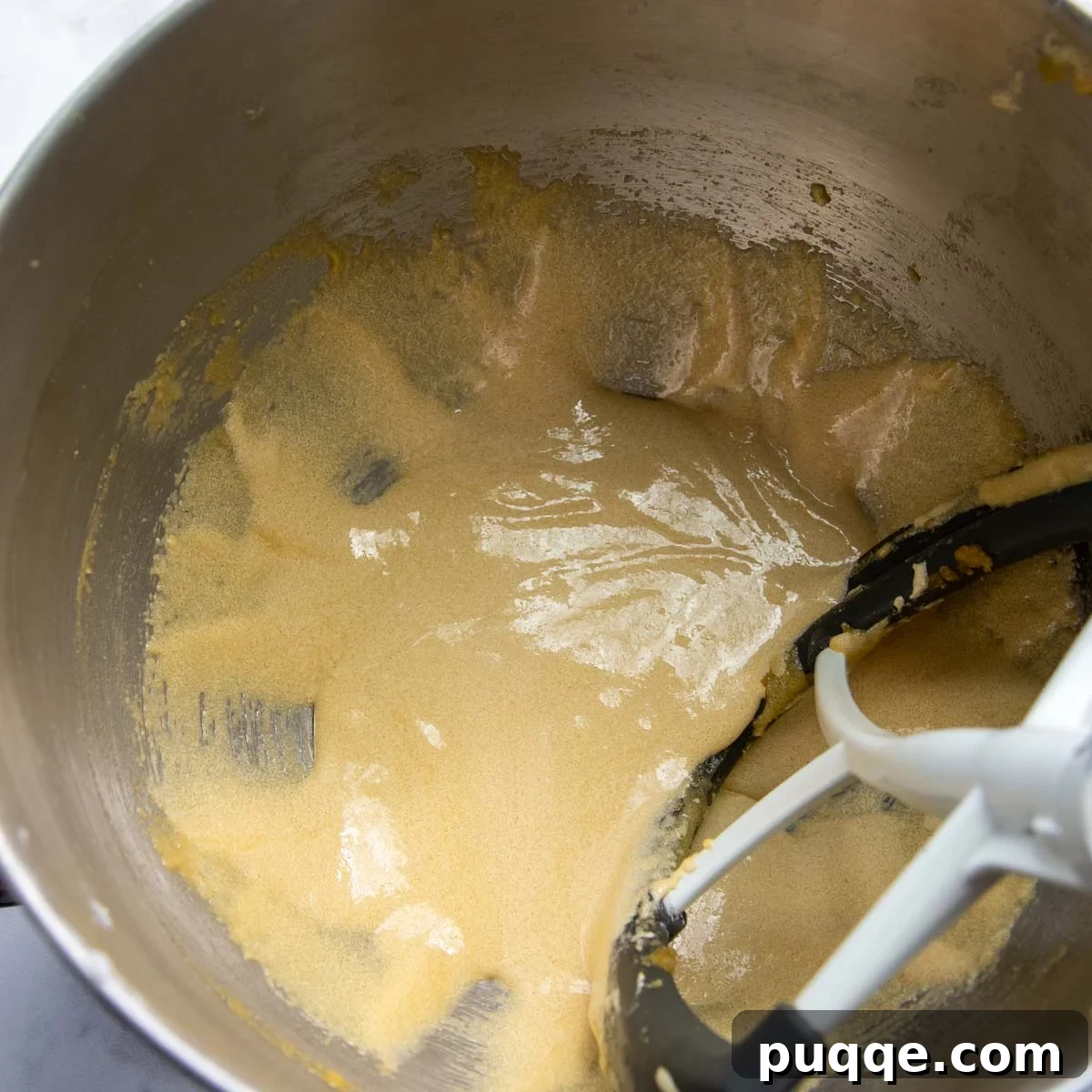 Cloud-Like Gluten-Free Almond Flour Carrot Cake 4 Egg yolks and sugars beaten together until pale and fluffy.