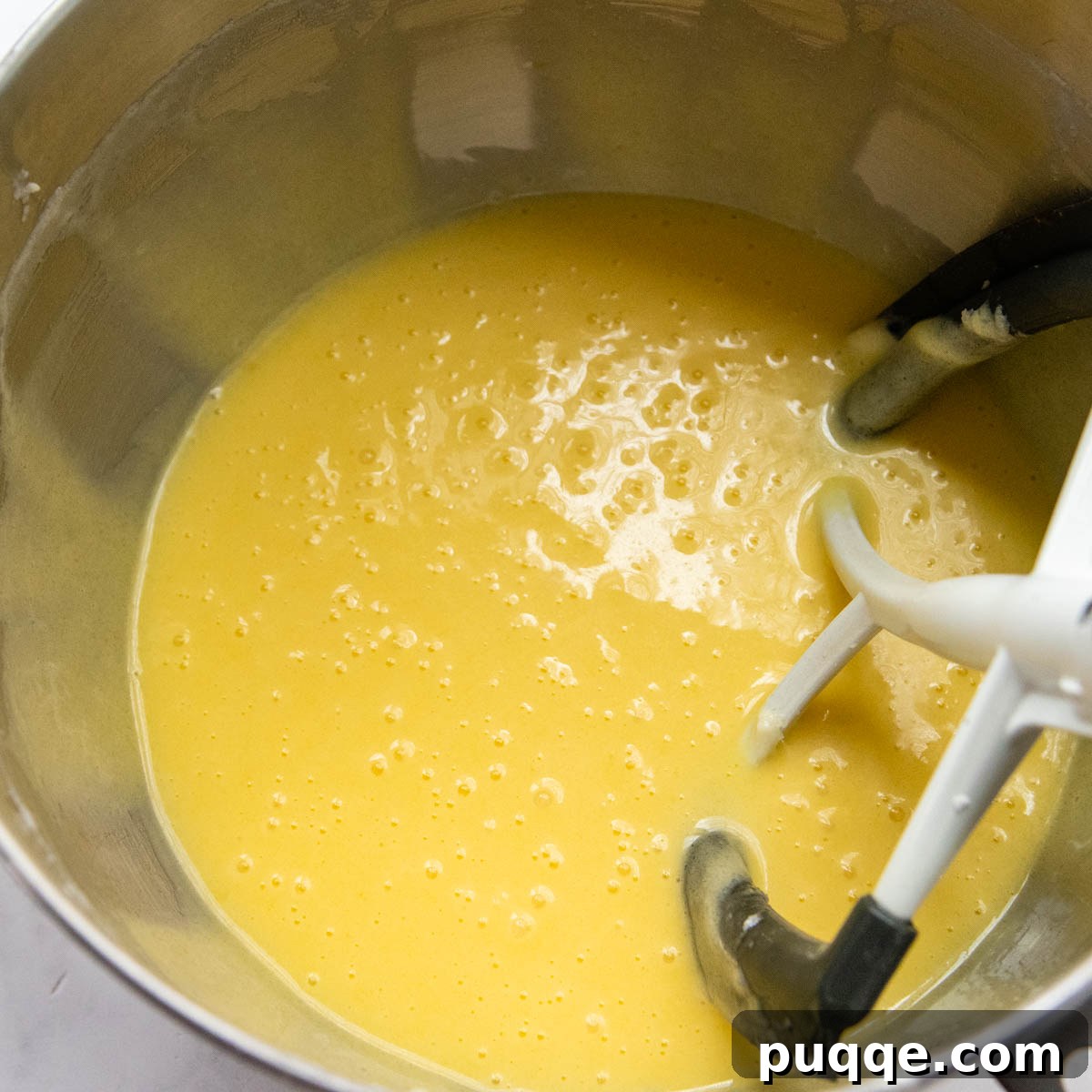 The Secret to Unbelievably Moist Gluten-Free Pound Cake 4 The smooth, thinned batter after incorporating eggs and vanilla extract, signaling readiness for dry ingredients.