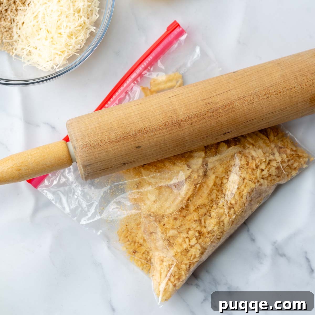 a rolling pin crushing the potato chips.