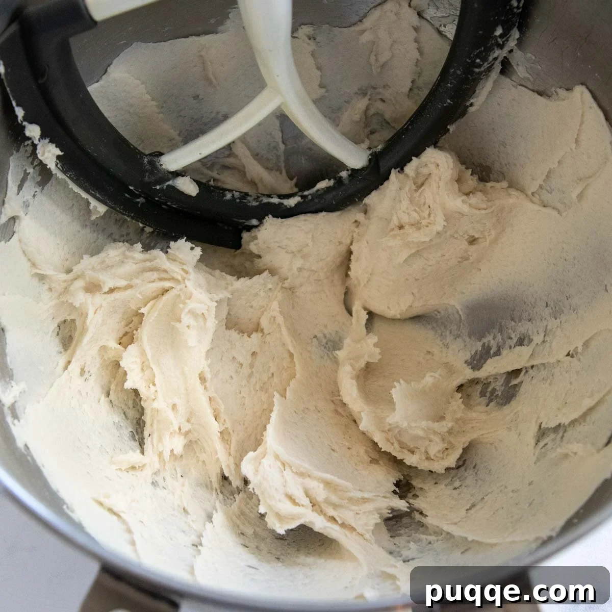 Foolproof Soft Gluten-Free Flatbread 3 Gluten-free flatbread dough after being mixed, showing a stiff, slightly sticky consistency in the mixing bowl.