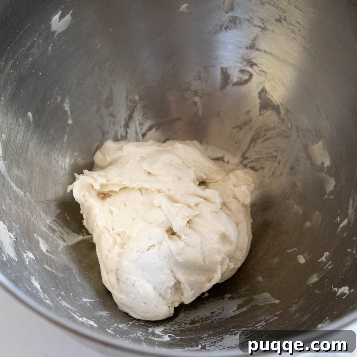 Foolproof Soft Gluten-Free Flatbread 4 Gluten-free flatbread dough in a bowl before rising, appearing slightly dense.
