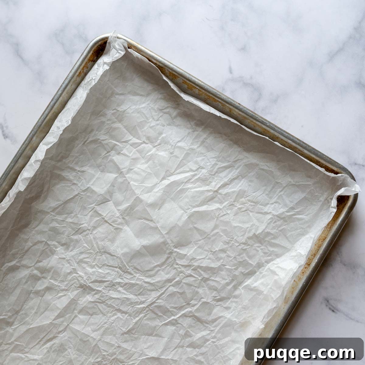 The Ultimate Gluten Free Ice Cream Sandwiches 3 A large baking sheet lined with crumpled parchment paper, ready for batter.