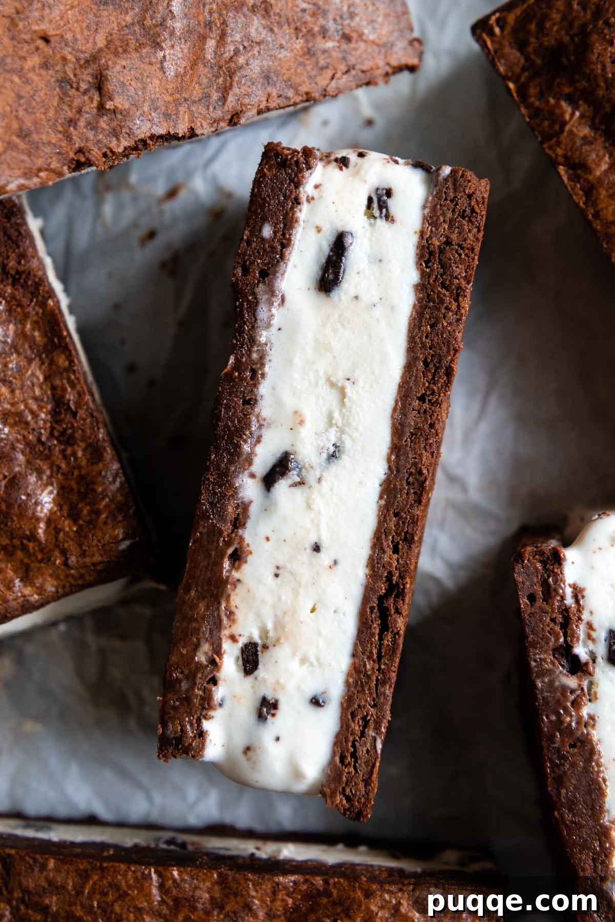 The Ultimate Gluten Free Ice Cream Sandwiches 10 A freshly made gluten-free ice cream sandwich, face up on a parchment-lined baking sheet.