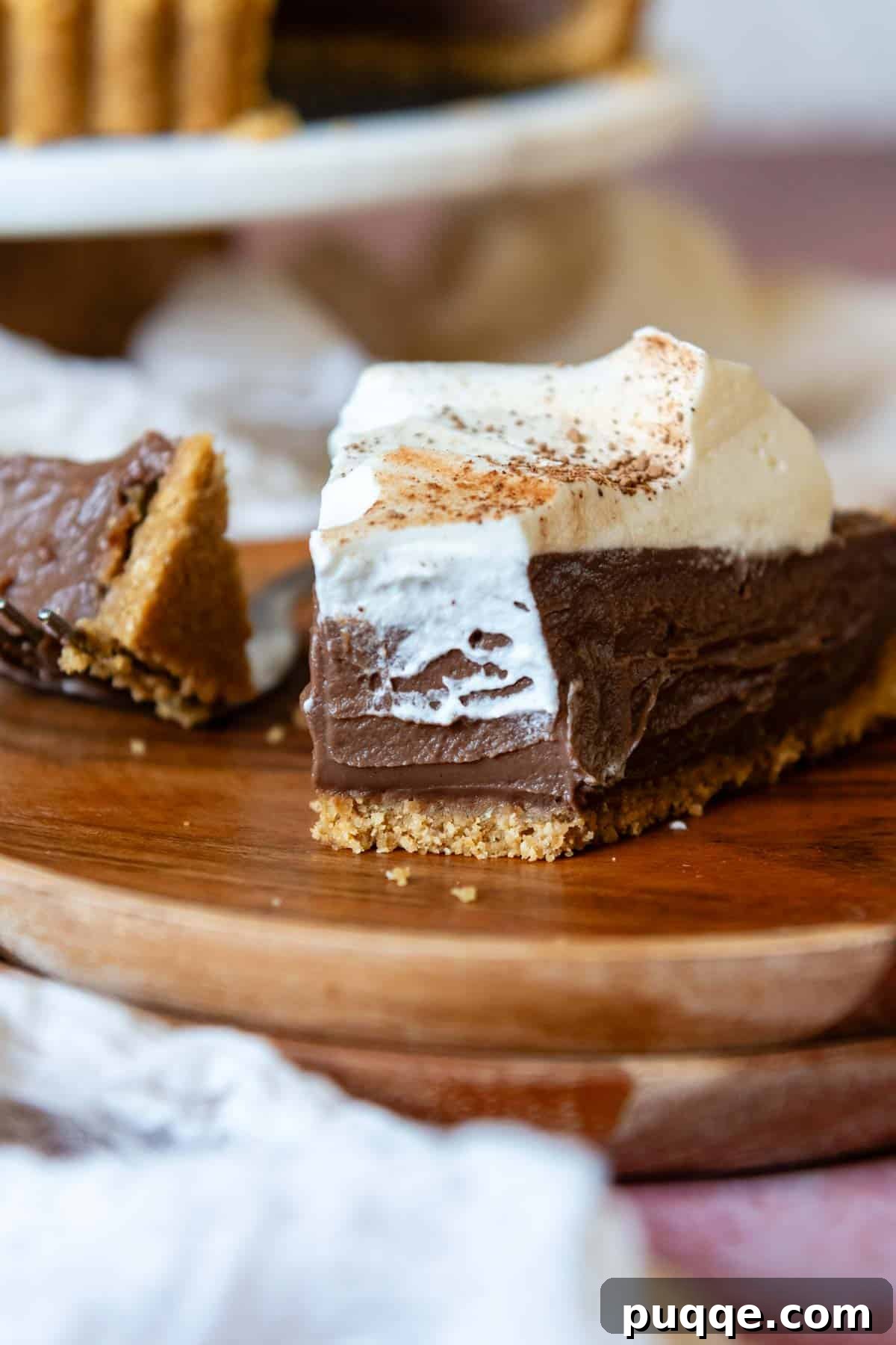 Quick Gluten Free Graham Cracker Crust Ready in 15 Minutes 11 a bite of chocolate tart on a wooden plate.