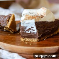 Quick Gluten Free Graham Cracker Crust Ready in 15 Minutes 12 a bite of chocolate tart on a wooden plate.