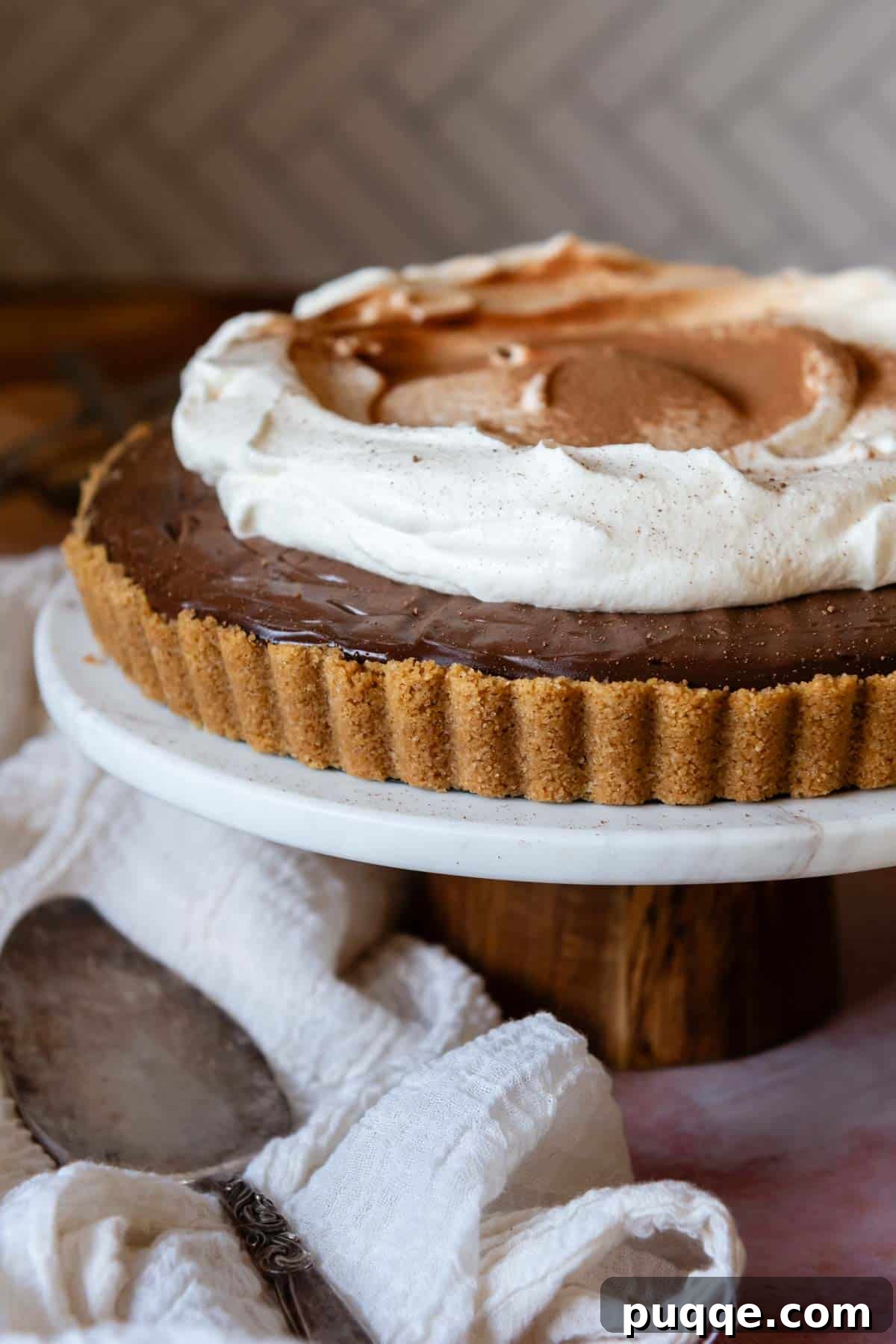 Quick Gluten Free Graham Cracker Crust Ready in 15 Minutes 3 chocolate tart with whipped cream on top.