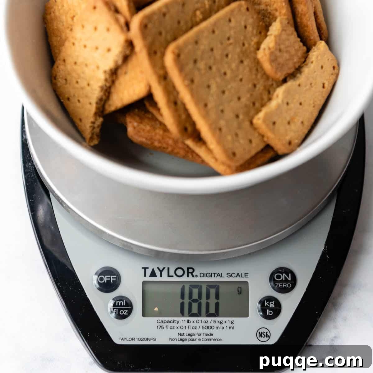 Quick Gluten Free Graham Cracker Crust Ready in 15 Minutes 6 a food scale weighing the graham crackers.