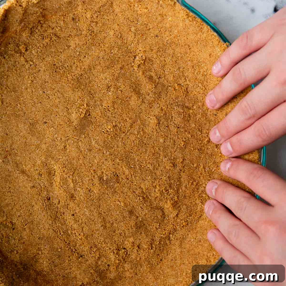 Quick Gluten Free Graham Cracker Crust Ready in 15 Minutes 10 fingers pressing the edges of the crust.