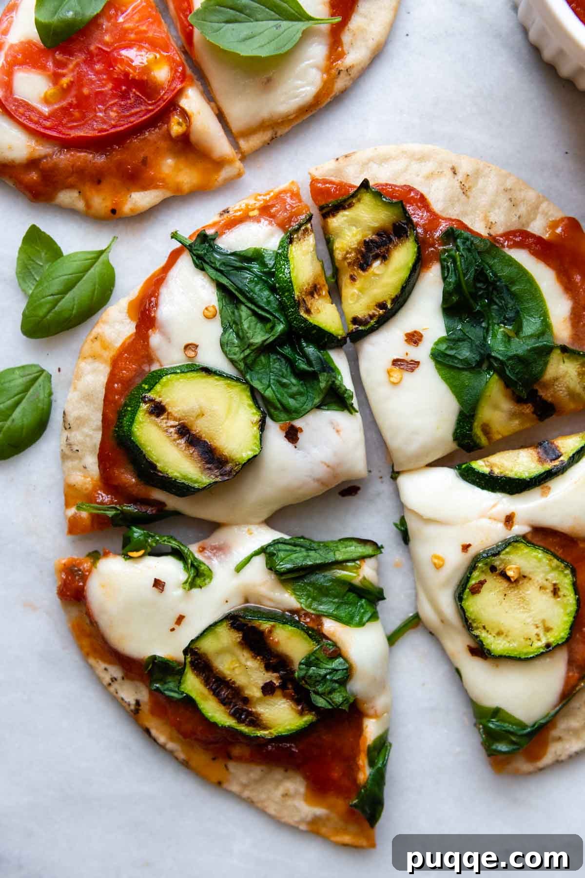 Grilling Gluten-Free Pizza: Easy Steps to Irresistible Results 8 sliced grilled pizza with zucchini on top.