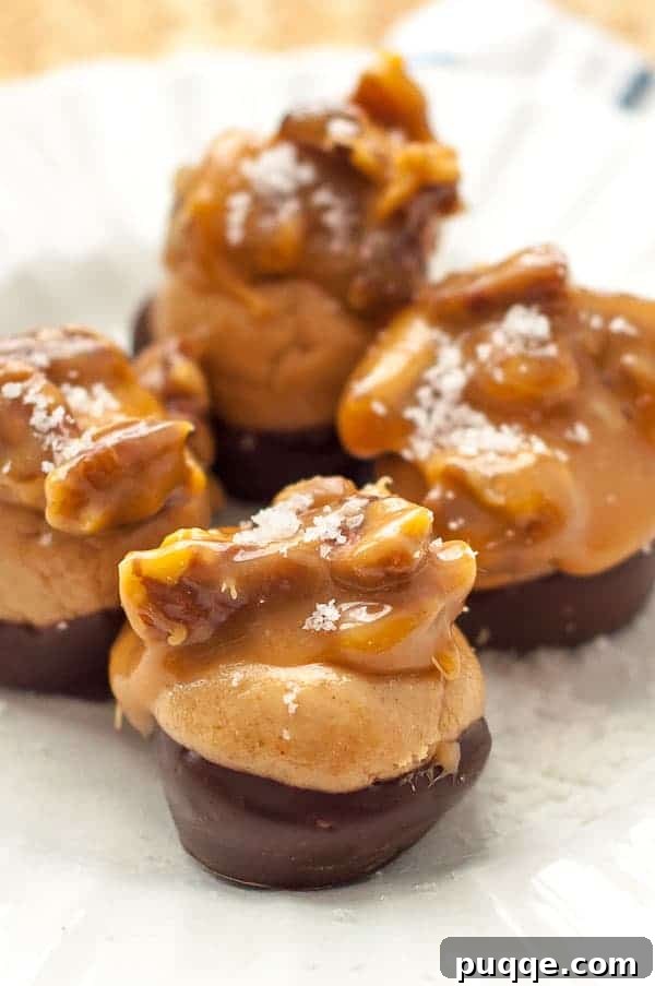 A close up shot of a plate of buckeyes candy with turtle topping, highlighting the rich chocolate, peanut butter, and caramel layers.