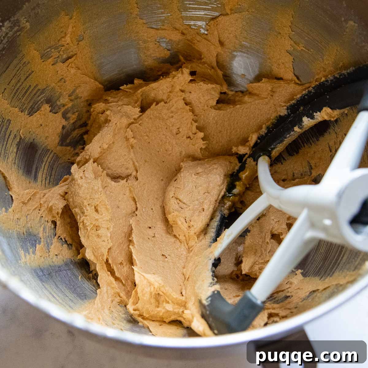 The Ultimate Chewy Gluten-Free Pumpkin Cookies 4 Cookie dough ingredients mixed together in a bowl, showcasing the creamy, uniform consistency before adding dry ingredients.
