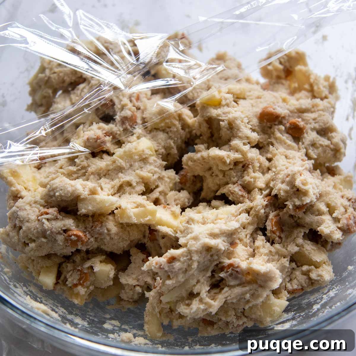 Scone dough in a bowl, covered with plastic wrap and ready for refrigeration.
