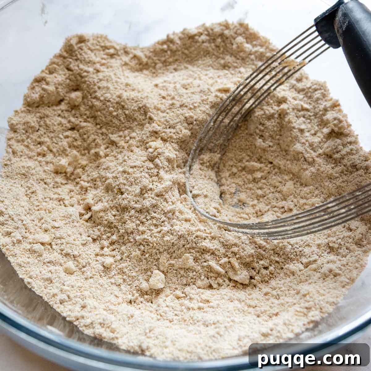 Cloud-Like Gluten-Free Oat Drop Biscuits 3 oat flour blended with cold butter pieces in a mixing bowl.