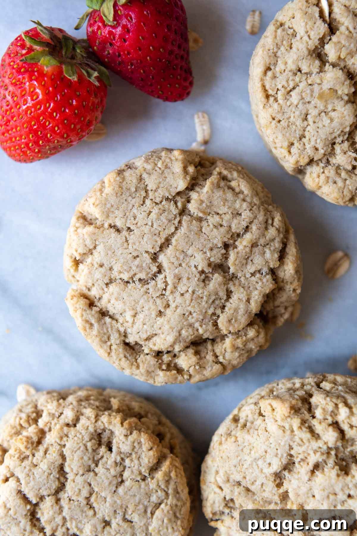 Cloud-Like Gluten-Free Oat Drop Biscuits 7 an overhead shot of freshly baked oat flour biscuits artfully arranged with fresh strawberries.