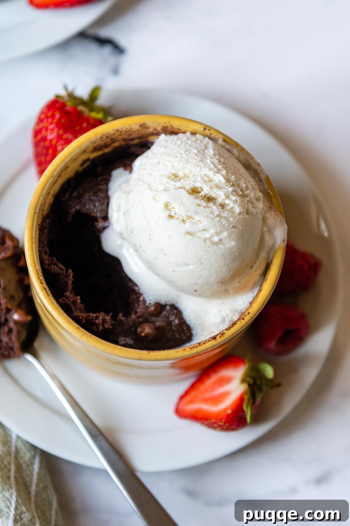 Effortless Gooey Fudgy Gluten-Free Mug Brownie 7 melting ice cream on top of a mug brownie.