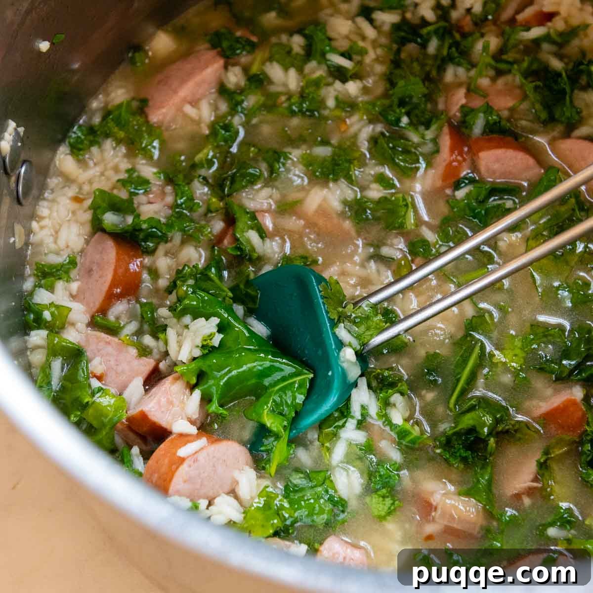 Chopped kale stirred into the soup to wilt.