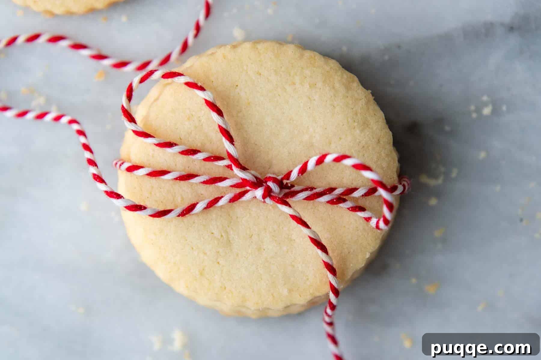 overhead shot of cookies with red string wrapped around.