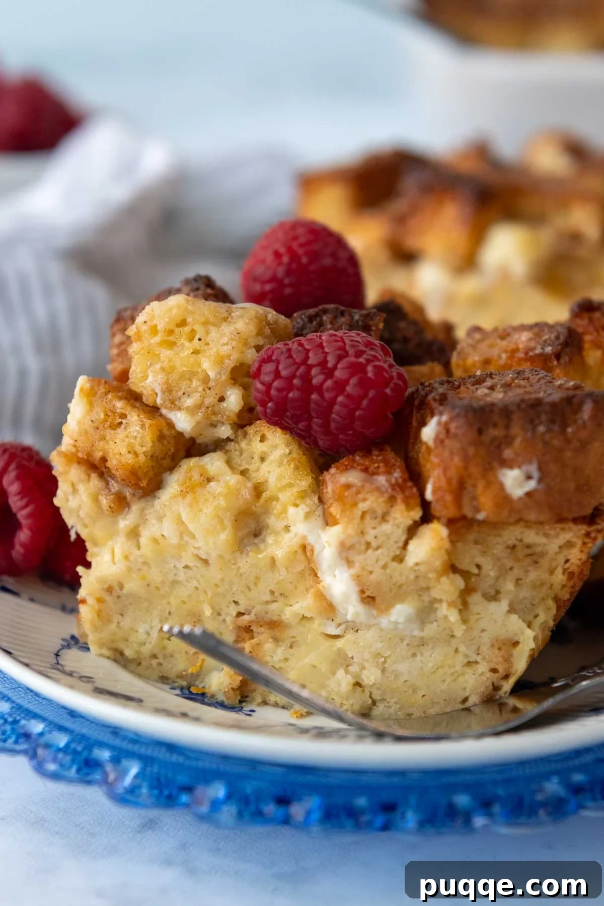 Perfect Overnight Gluten-Free French Toast Casserole 2 Close up of a slice of moist gluten-free French toast casserole with a golden-crisp topping.