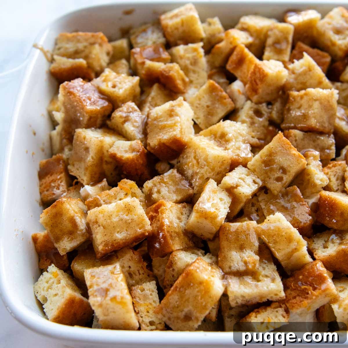 Perfect Overnight Gluten-Free French Toast Casserole 6 The brown sugar butter topping being brushed onto the casserole before baking.