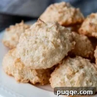 macaroons piled onto a white plate.
