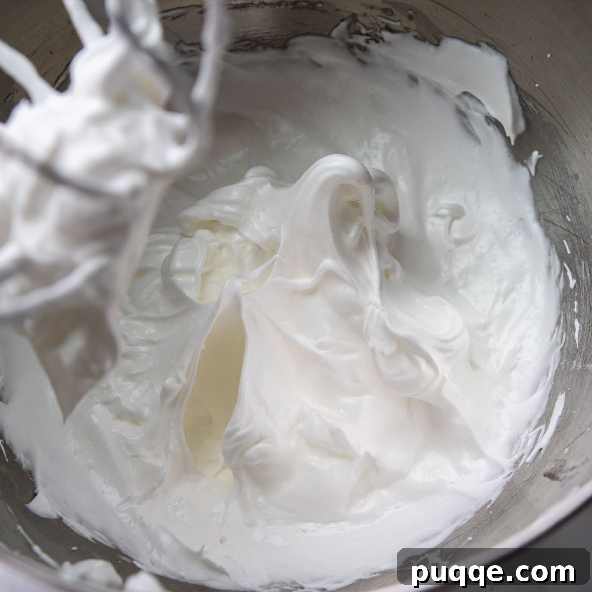 Featherlight Gluten-Free Coconut Delights 6 egg whites beaten into stiff, glossy peaks after sugar addition.