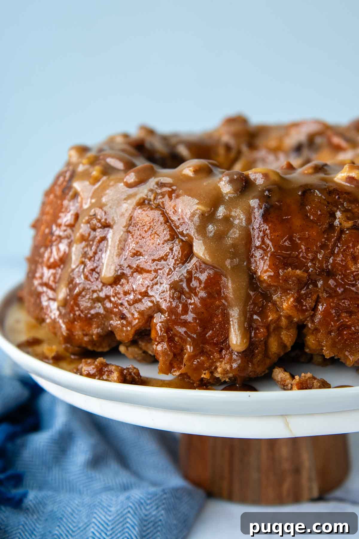 Melt-in-Your-Mouth Gluten Free Sticky Pull Apart Bread 13 A whole gluten-free cinnamon pull-apart bread beautifully displayed on a cake platter, ready to be enjoyed.