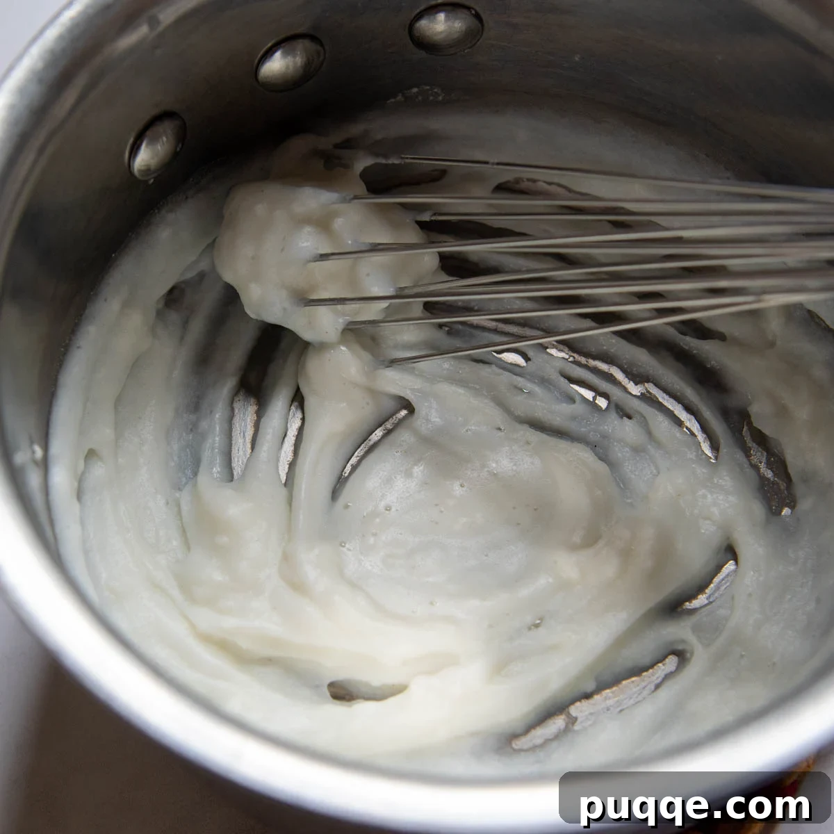 Melt-in-Your-Mouth Gluten Free Sticky Pull Apart Bread 3 The smooth, thickened roux mixture in a saucepan, ready for cooling.