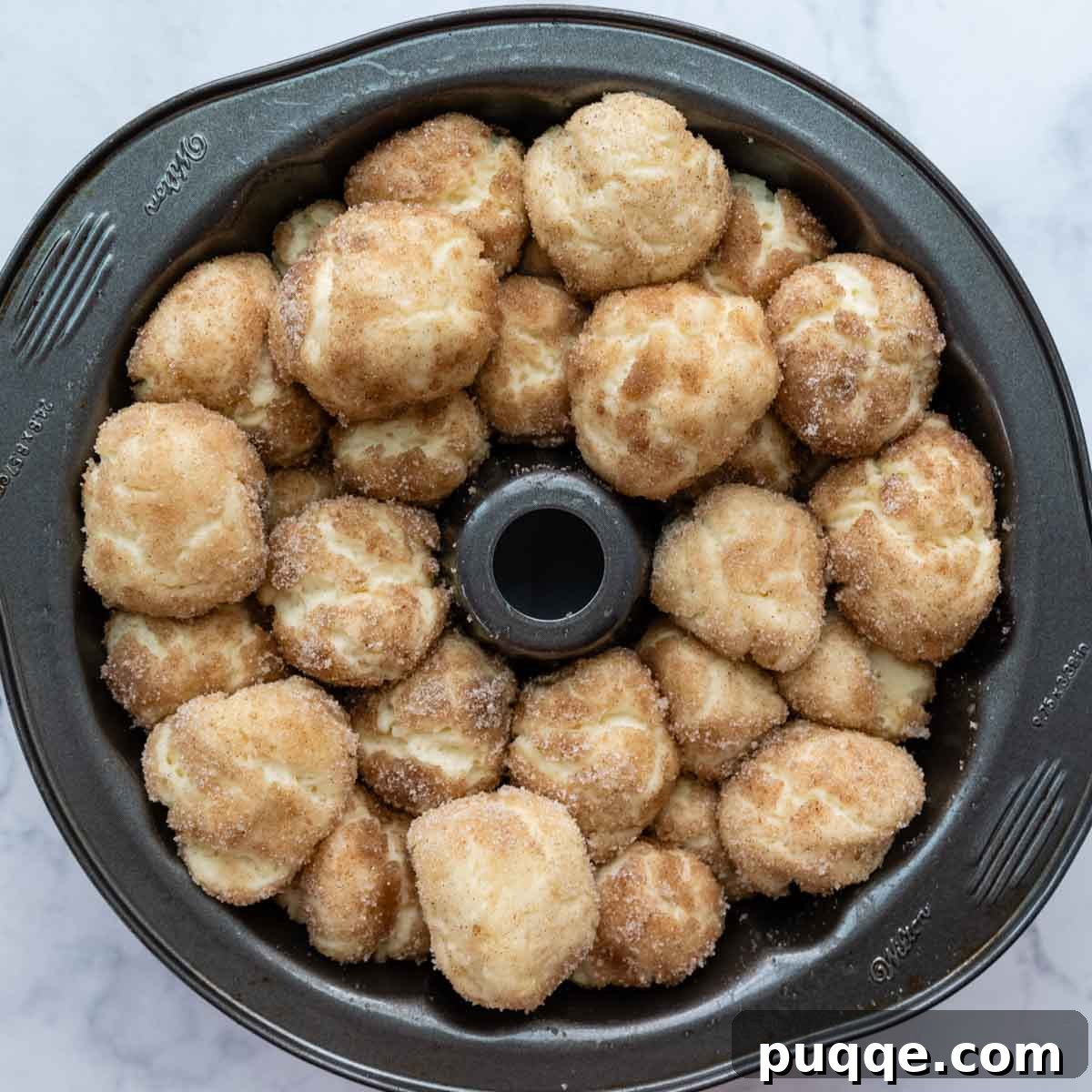 Melt-in-Your-Mouth Gluten Free Sticky Pull Apart Bread 9 The dough balls in the bundt pan, visibly expanded after their rising period, before baking.