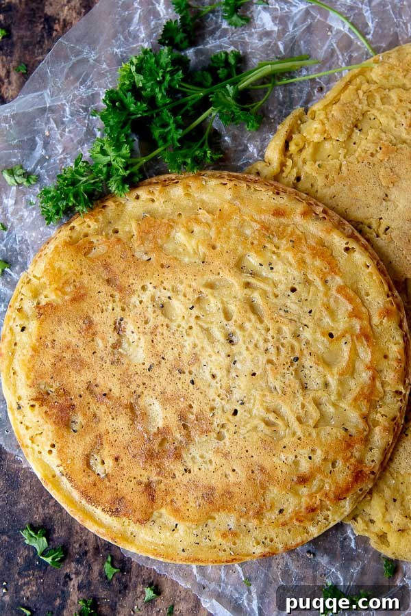 Your Go-To 5-Ingredient Socca Flatbread 2 an overhead shot of a round socca with parsley laying next to it