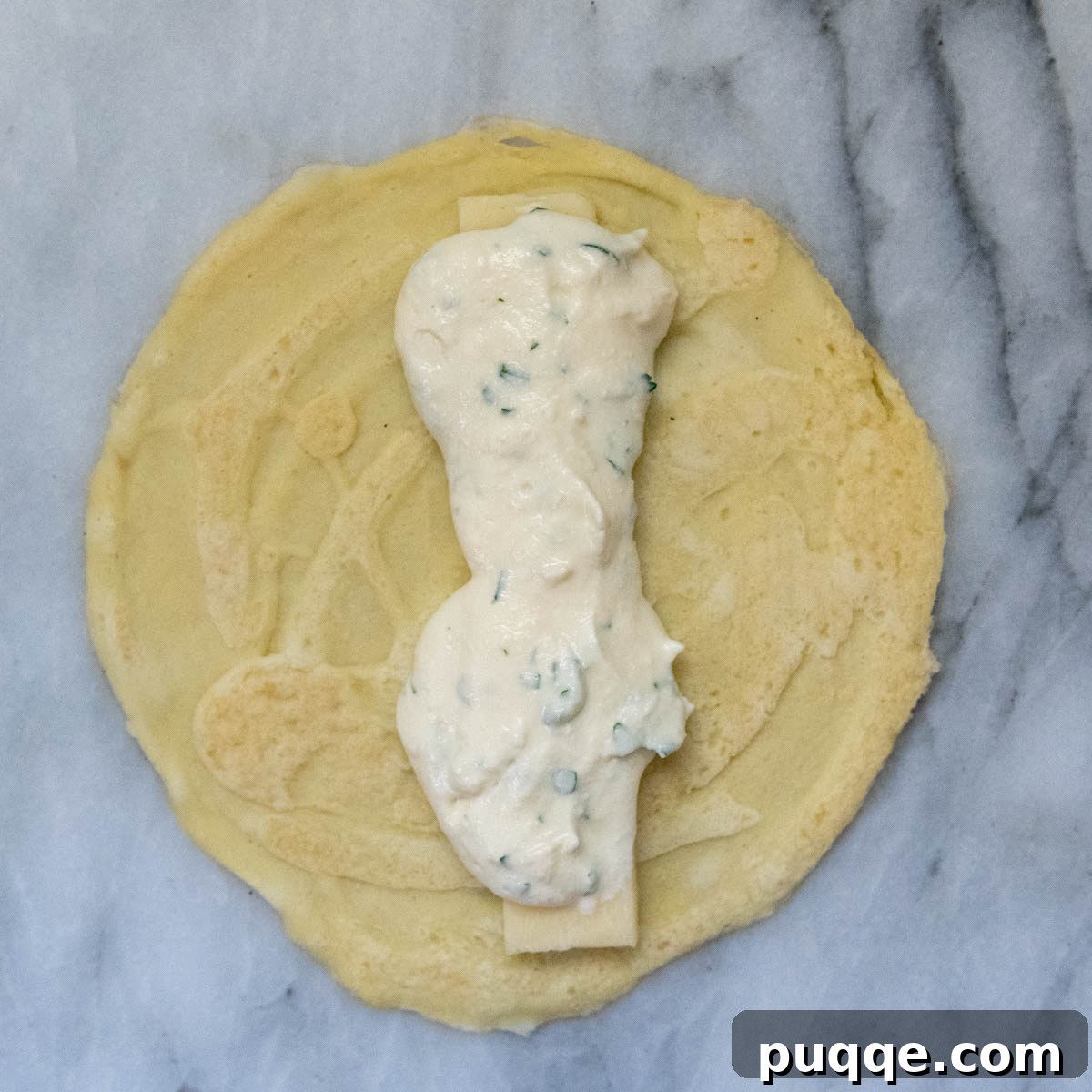 Effortless Homemade Gluten-Free Manicotti with Tender Crepe Shells 8 ricotta filling carefully spread over the mozzarella cheese on a crepe.