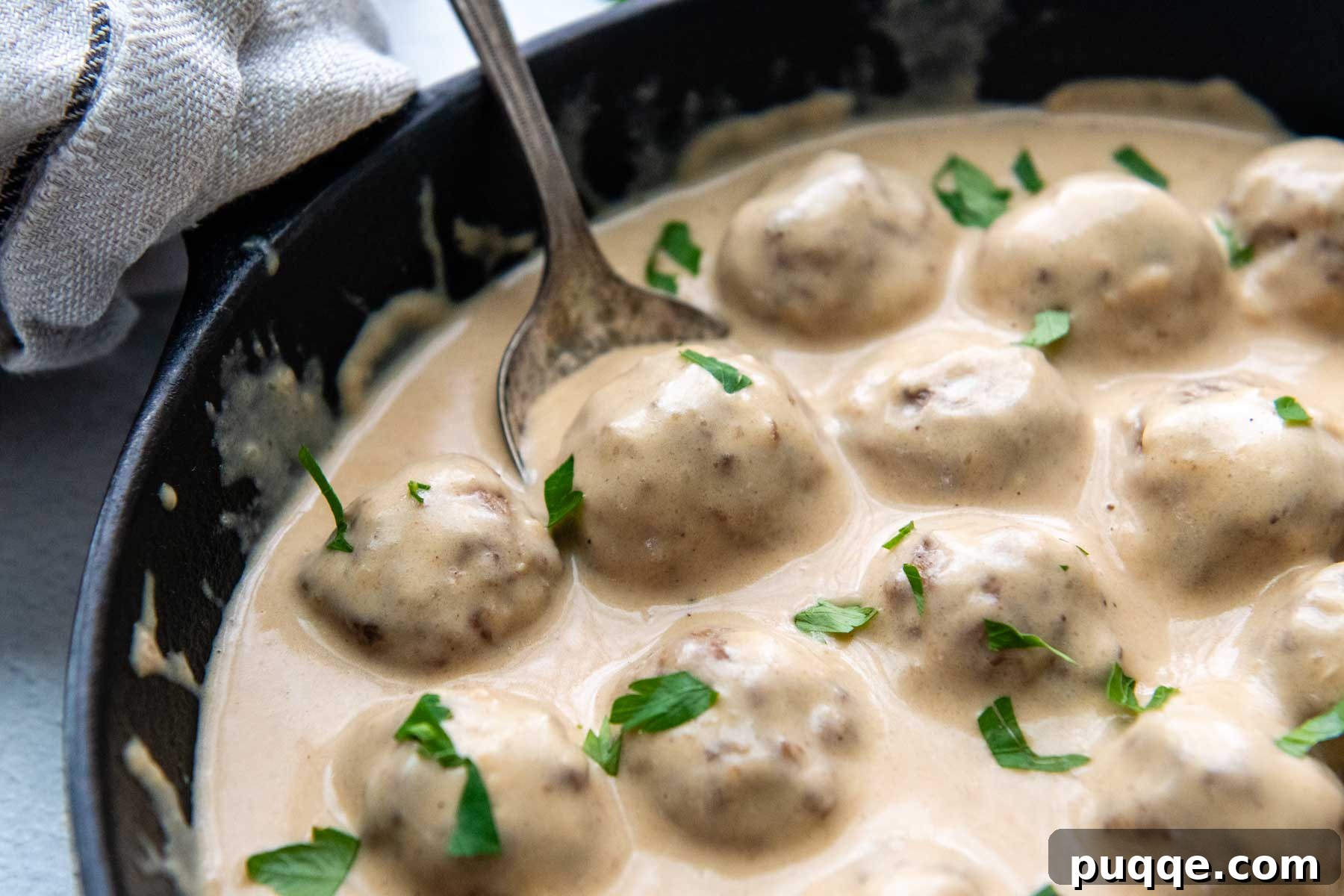 Effortless Oven Baked Gluten-Free Swedish Meatballs 3 The perfectly browned and saucy gluten-free Swedish meatballs nestled in their creamy gravy.