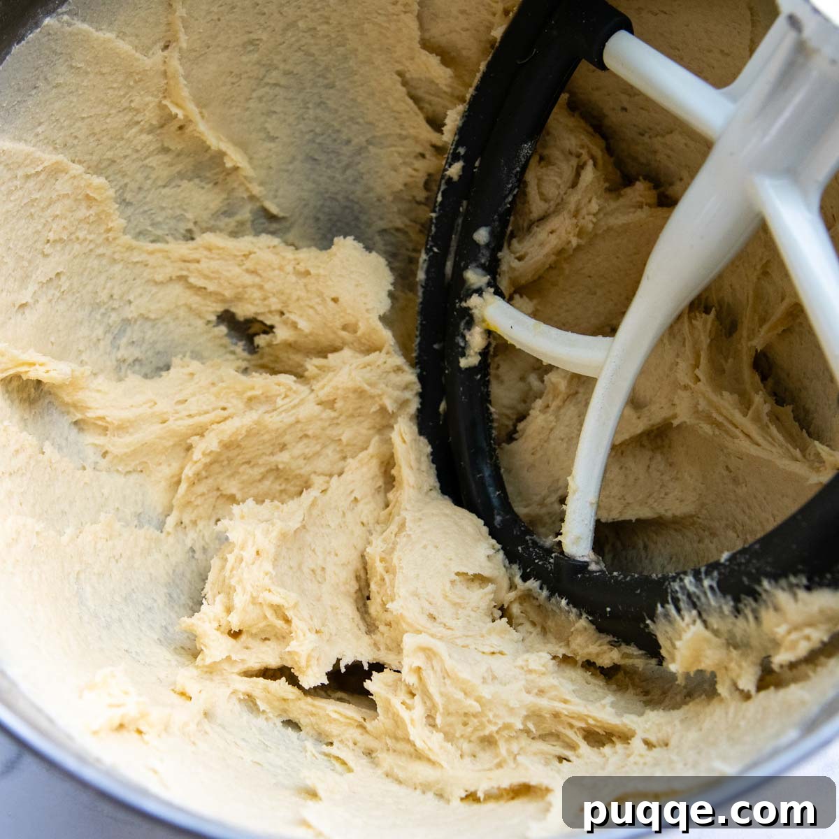 Effortless Homemade Gluten-Free Italian Bread 3 The stiff, sticky gluten-free dough ready for shaping in a stand mixer bowl.