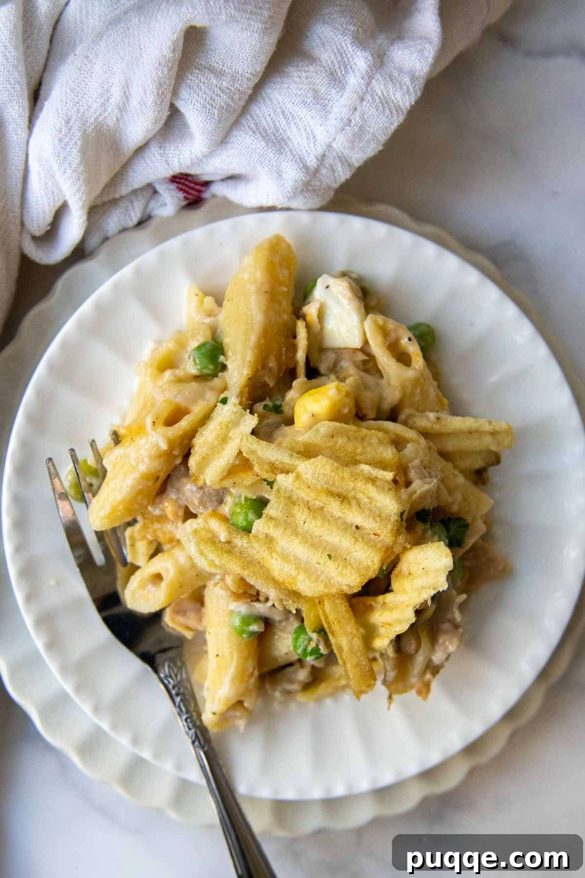 Wholesome Gluten-Free Tuna Noodle Casserole 6 overhead shot of a serving of tuna casserole on a white plate
