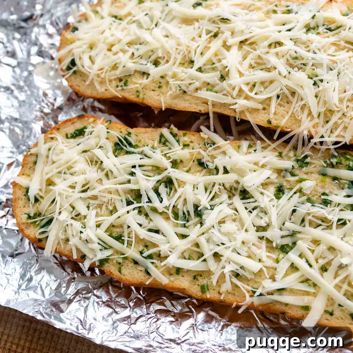 Split gluten-free bread halves with optional cheese sprinkled on top, ready for their final bake.