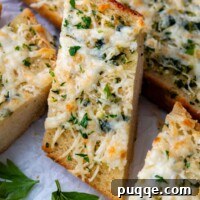 a slice of garlic bread resting on other slices.