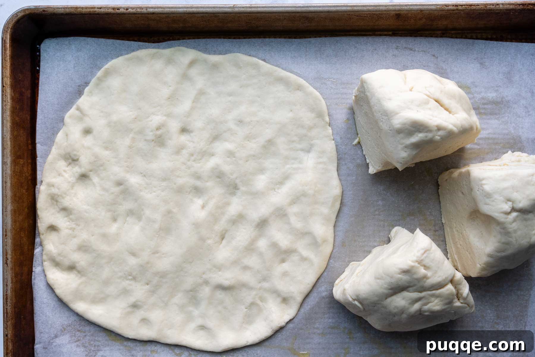 Pillowy Soft Gluten-Free Calzones 5 One portion of gluten-free calzone dough gently patted out into a uniform 8-9 inch circular disc.