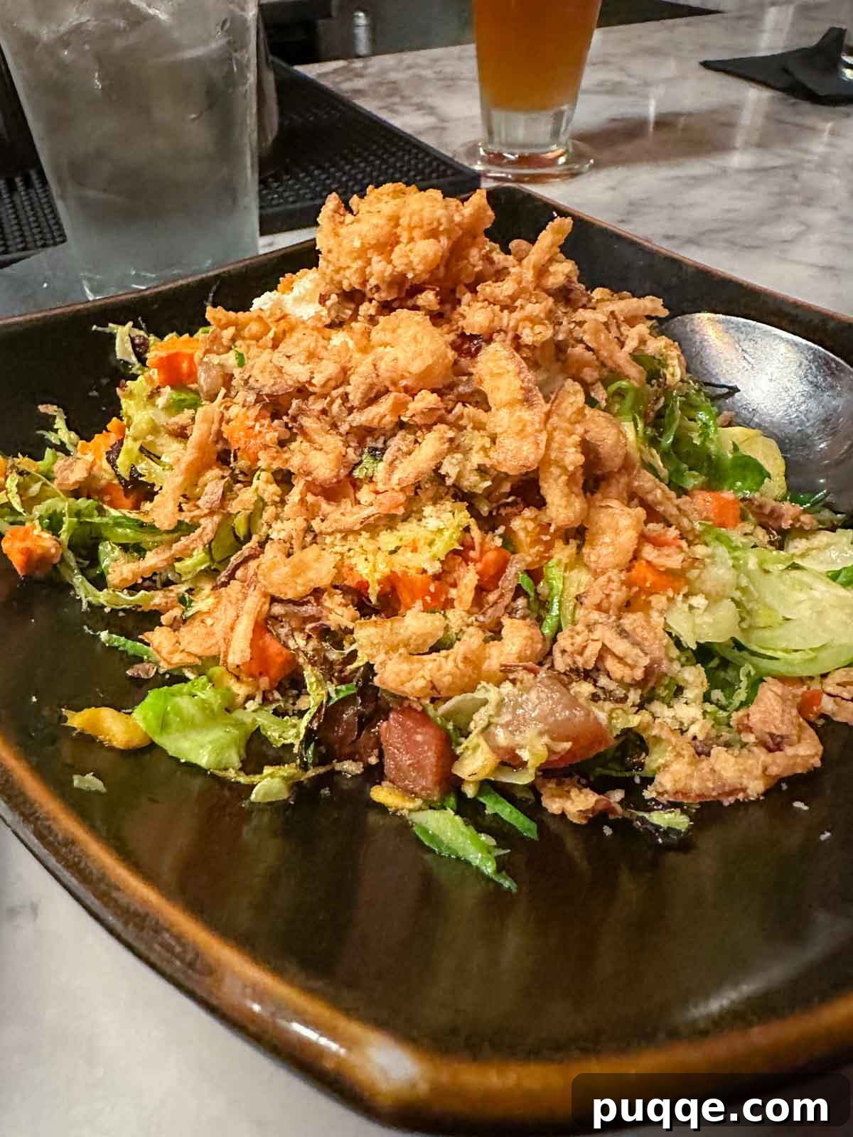 A plate of perfectly fried Pow Pow Shrimp, a delicious gluten-free small plate from The Laundry