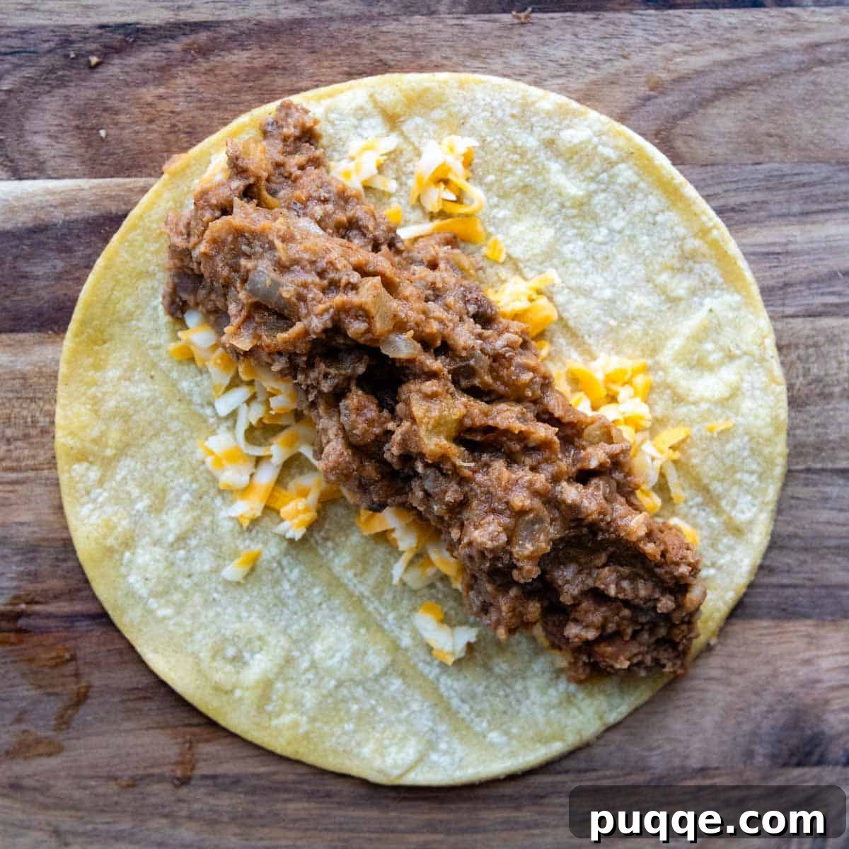Ultimate Gluten-Free Cheesy Beef and Bean Enchiladas 6 A warmed corn tortilla generously filled with cheese and the beef and bean mixture.
