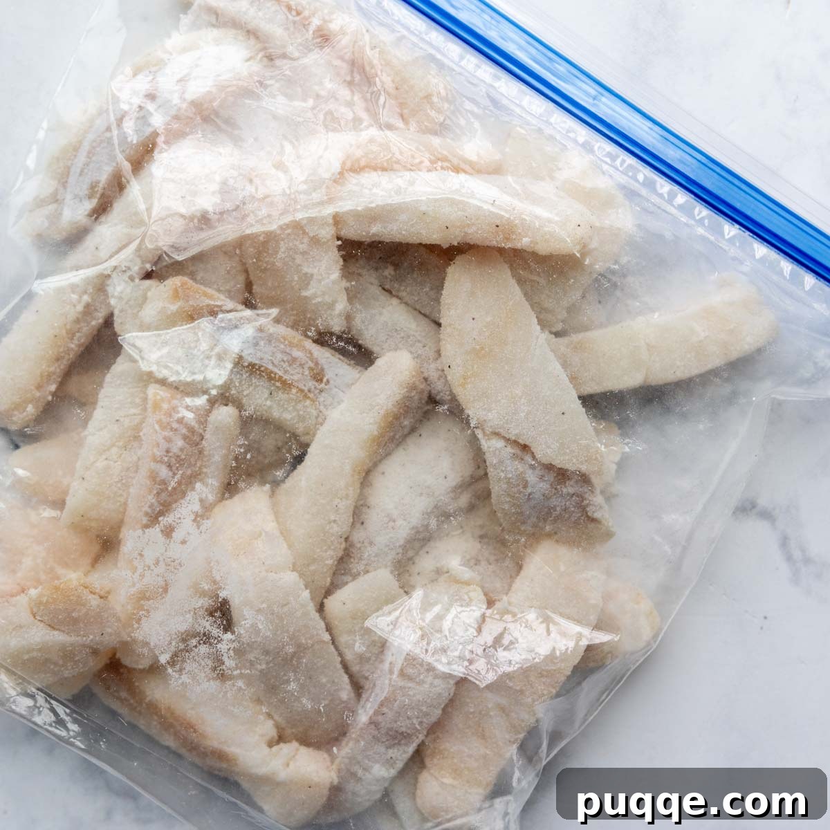 pieces of fish in a bag dredged with flour.