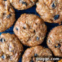 Overhead shot of gluten-free morning glory muffin tops, perfectly baked and close together.